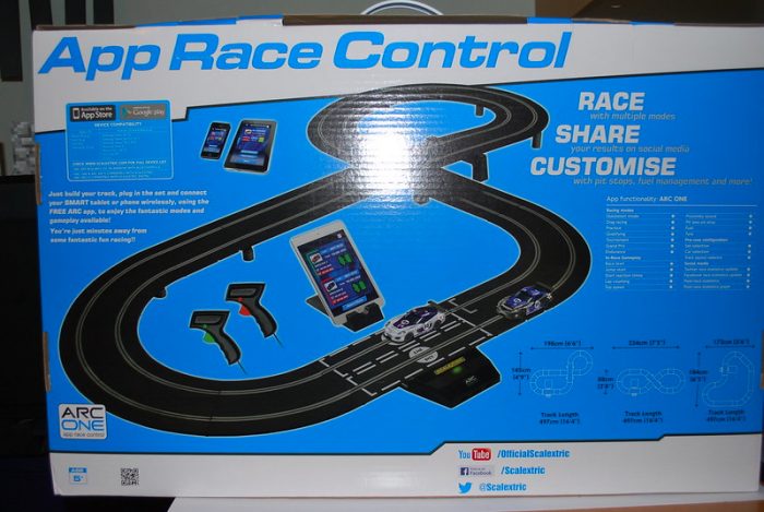 A big box of quality toy race car track set placed on top of white table. 