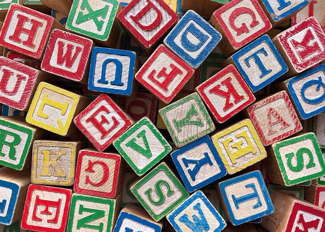 wooden blocks that have the alphabet on them