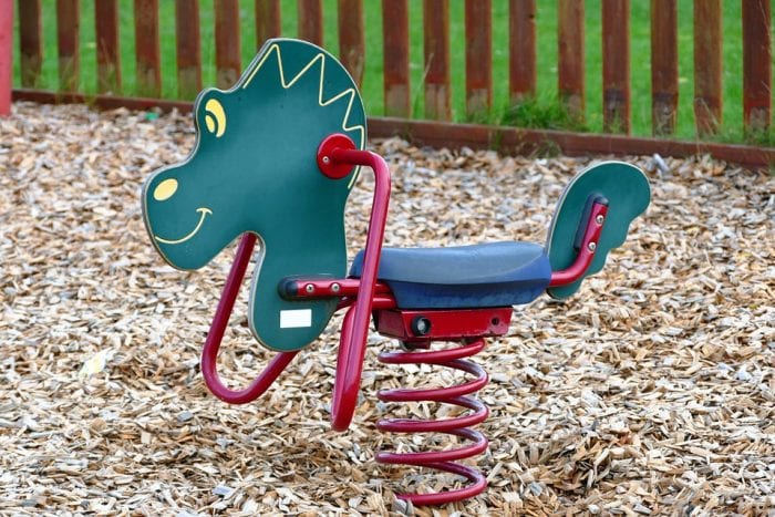 A spring rocking horse with blue and red combination.