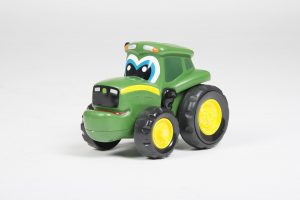 The best green toy car with black and yellow wheels. The front of the toy car has a cartoon face. 