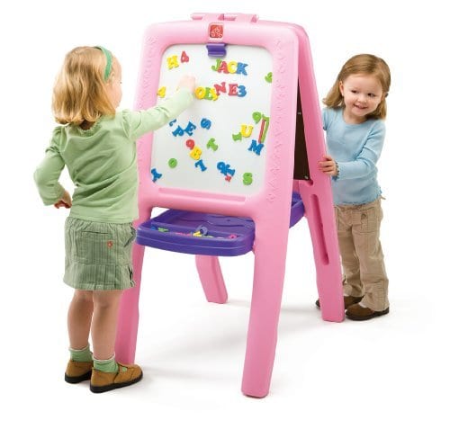 chalkboard sets- Two young girls happily drawing on a pink chalkboard together, expressing their creativity and enjoying playtime