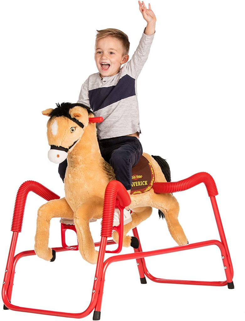 A boy riding a Rockin' Rider Maverick Plush Spring Toy Horse. A spring rocking horse that is made of a sturdy steel frame which ensures safety while enjoying bouncing nonstop.