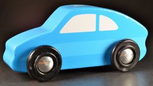 A minimalist blue toy car. It does not have a realistic door and window. This is one of the best minimalistic toy cars on the market.