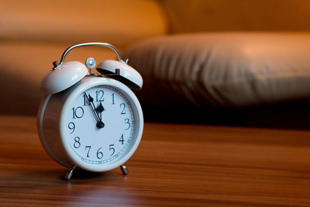 An alarm clock is essential when sleeping.