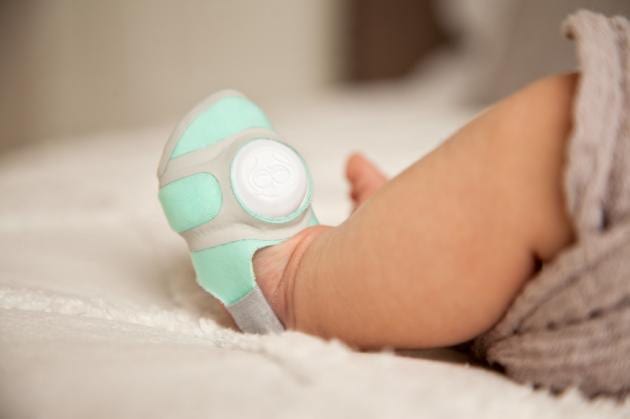 Owlet smart sock and connected care app to monitor your baby. baby monitor in feet