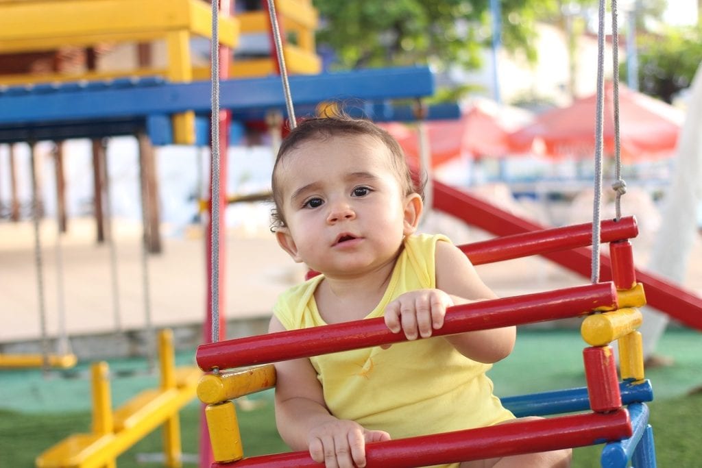 A toddler in the playgroung