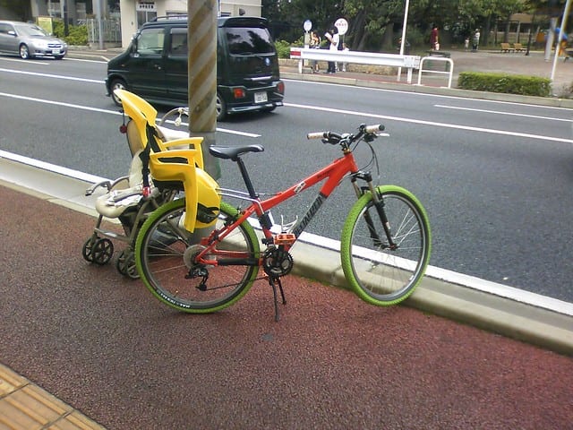 perfect bike seat, great bike seat, colorful bike seat. Bike parking. Free bike parking. Bike in the city. Bike with seat. Bike wheels.