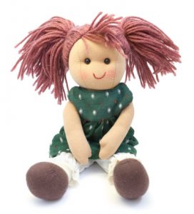 not your usual toy for a little kid, pinkish hair and a green dress with brown shoes and white tights