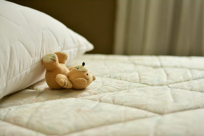Teddy on a mattress. A child's mattress should always be clean.