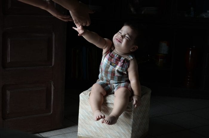 This little girl is crying while trying to reach her mom's hand. Separation anxiety among kids can be difficult to deal with. It really needs an amazing way to solve this kind of worry from the parents especially when they sleep or can't sleep. 