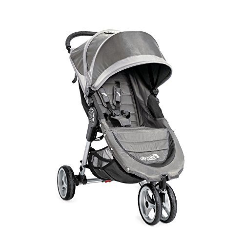Select Stroller: A stylish grey baby jogger stroller stands out with its padded seat and large sun canopy, ready to provide a comfortable ride for a baby in the city.