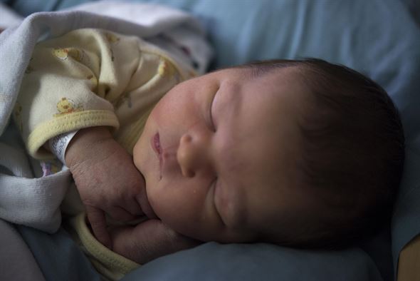 a baby sleeping on their side. it's okay for your baby to nap on its side.