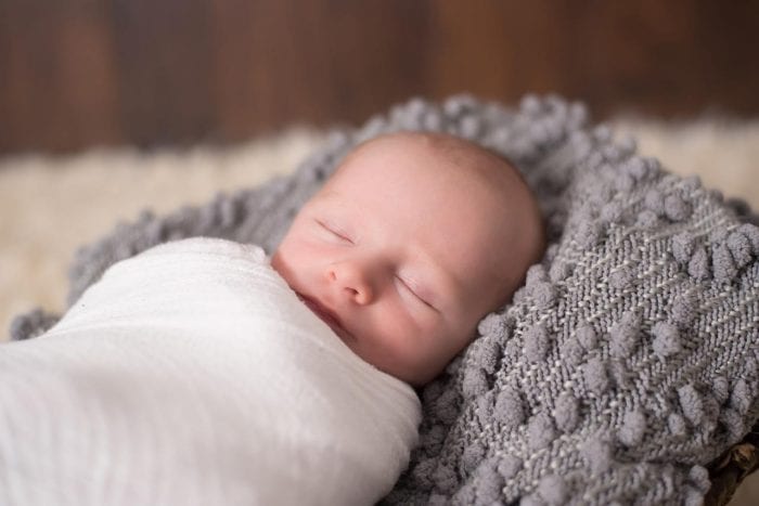Can a 3 month old sleep on their side sales