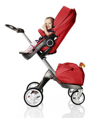 baby is very happy on a red Stokke stroller, moms should get this wonderful baby pram from the official Stokke store