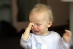 13-month old baby crying. Feeding schedule late?