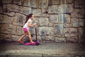 child riding a moped