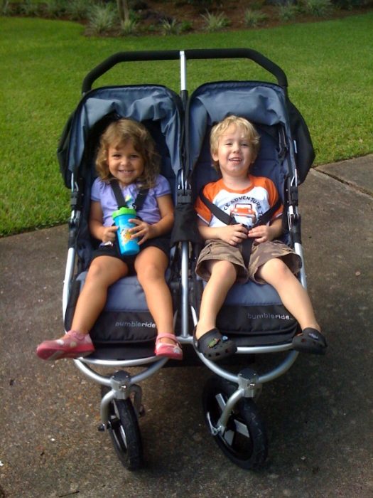 Two siblings in their best double stroller