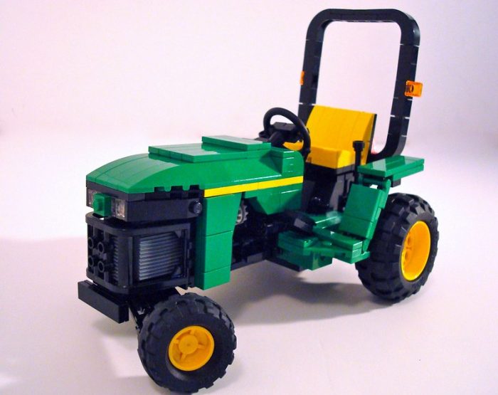 A lego-like green pedal toy car fully-functioning and an entertainment option for your little one as it is not your usual toy