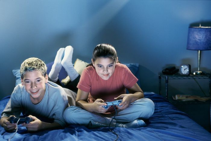 A boy and a girl playing the top games and toys for twelve years aged boys