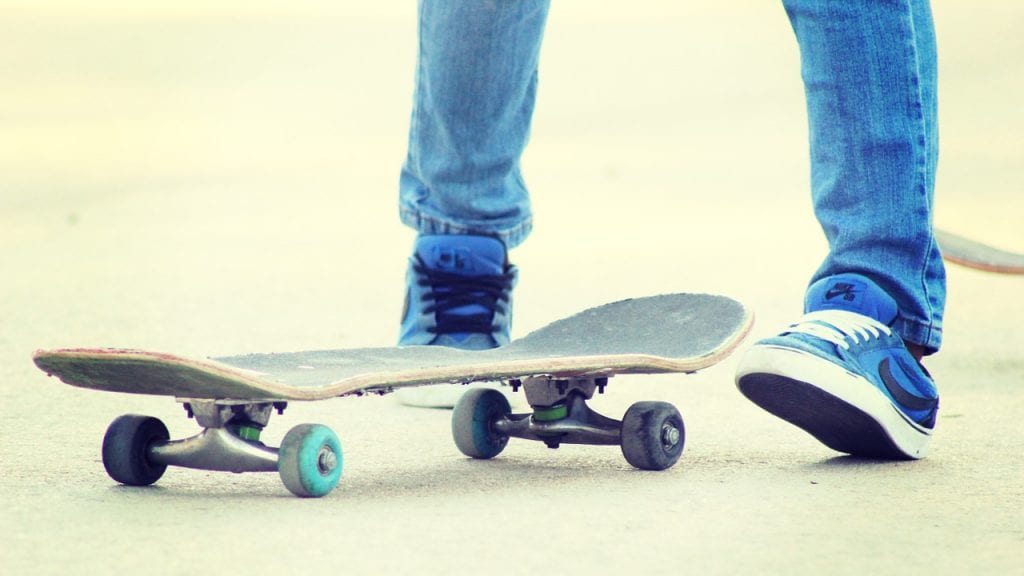 For 12-year-aged boy top rides a skateboard, embracing the thrill of cruising outdoors; for boys.