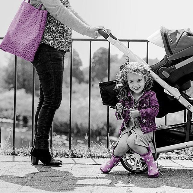 Mom and daughter with a Nuna carriage