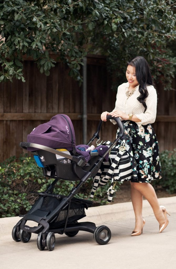 Mom and baby with a cute but sturdy Nuna carriage.