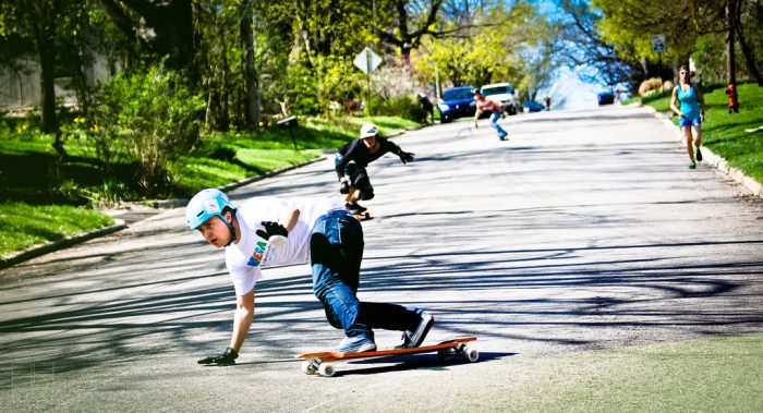 Boys exercising and having fun in skateboarding