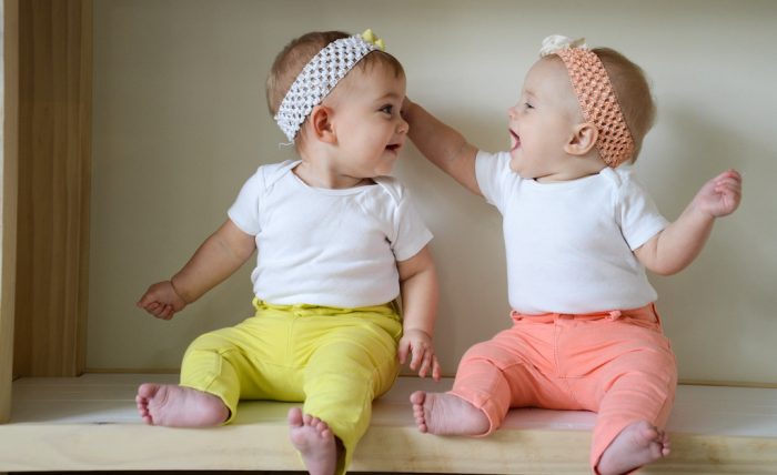Best Diaper Packs For Newborn twins: Twin babies having a good time.
