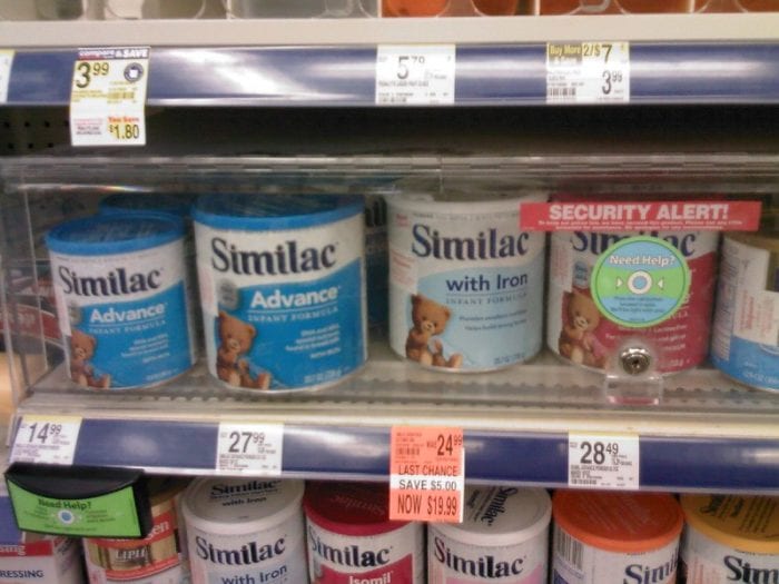 Enfamil Gentlease VS Similac: Milk formula cans in the grocery.