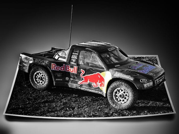 Rugged black car featuring the iconic Red Bull sign for a show, showcasing powerful and dynamic combination of style and energy in automotive design.