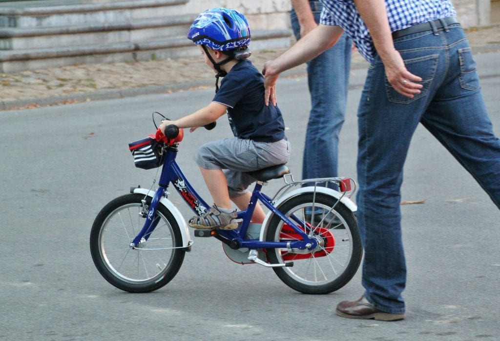 boy riding his bike