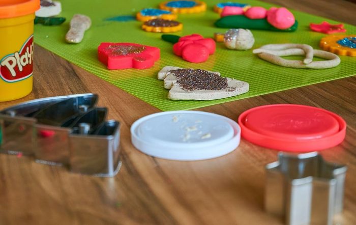 Assorted colorful cookie cutters.