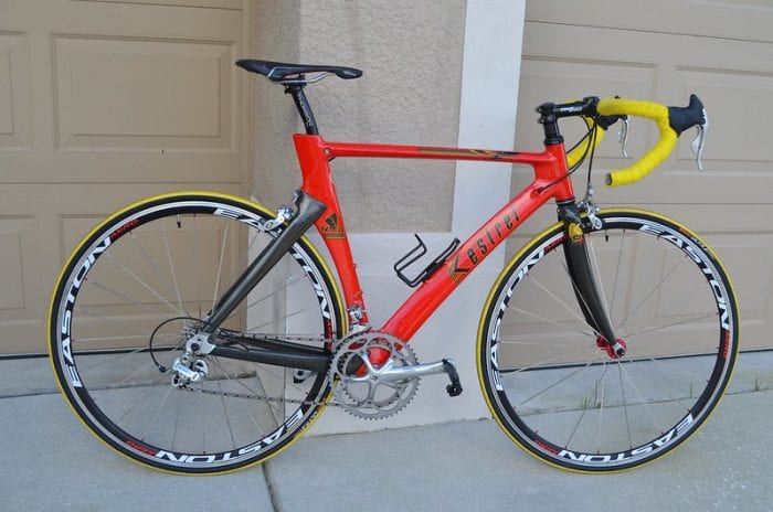 red bicycle with yellow handlebars