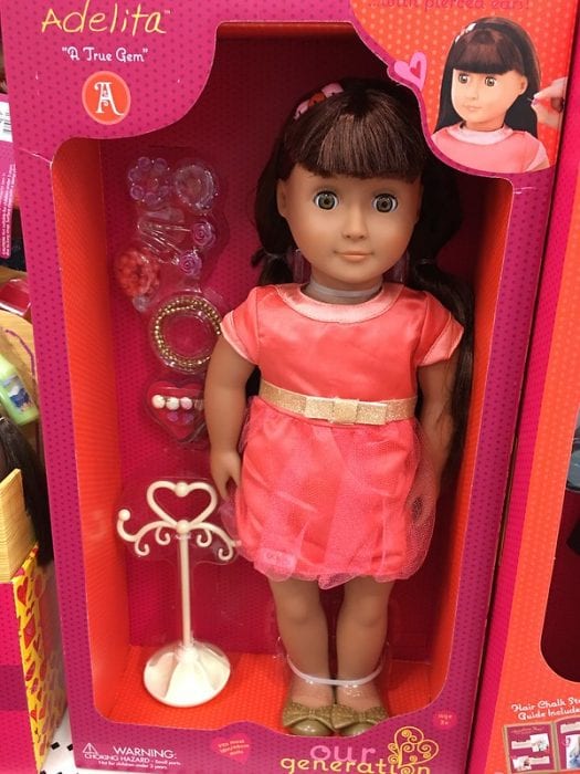 Dressing up dolls and selecting accessories encourages children to express their individuality and style preferences. The name of this doll is Adelita. 