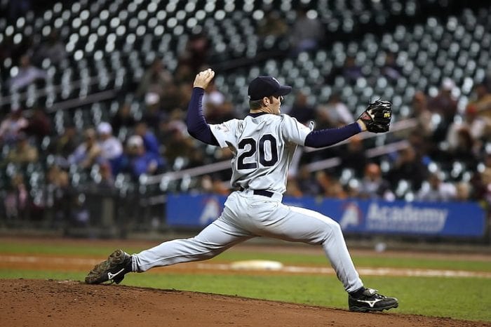 A person playing baseball on the field.