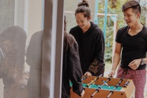 Two individuals engaged in a playful match at the best football tables, enjoying their game time together.