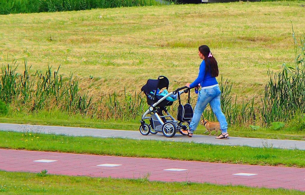A mom with a baby in Tavo Nuna stroller