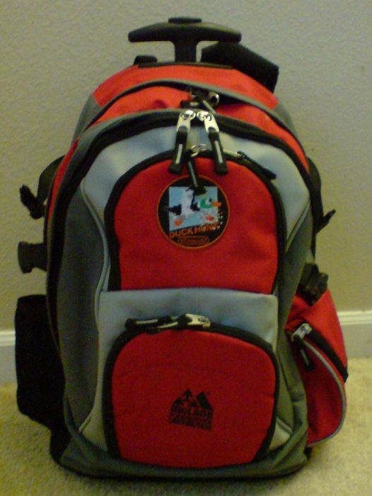 A rolling backpack in red color.