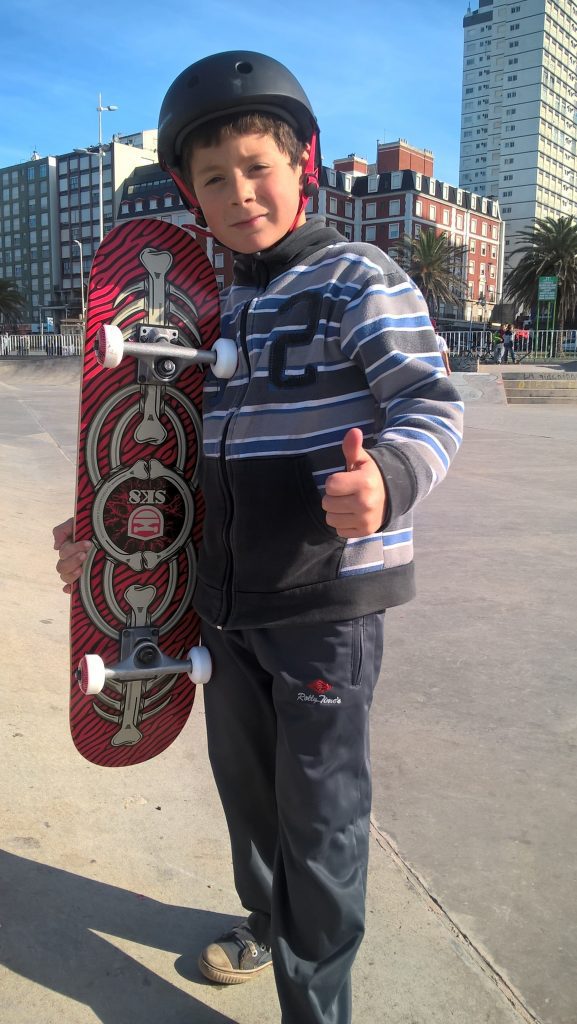 Best skateboard for all year old kids - Skateboard best for 6 year old, happy kid holding his own skateboard for a picture