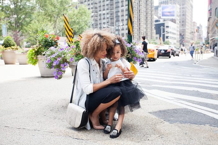 Mother and her daughter in their matching outfits.