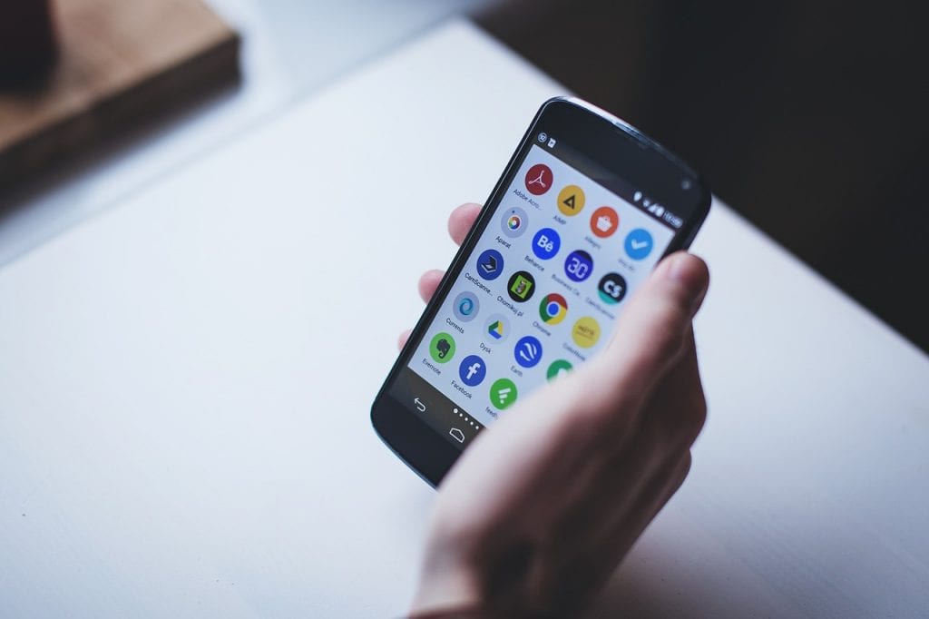 A close-up of a hand holding a phone