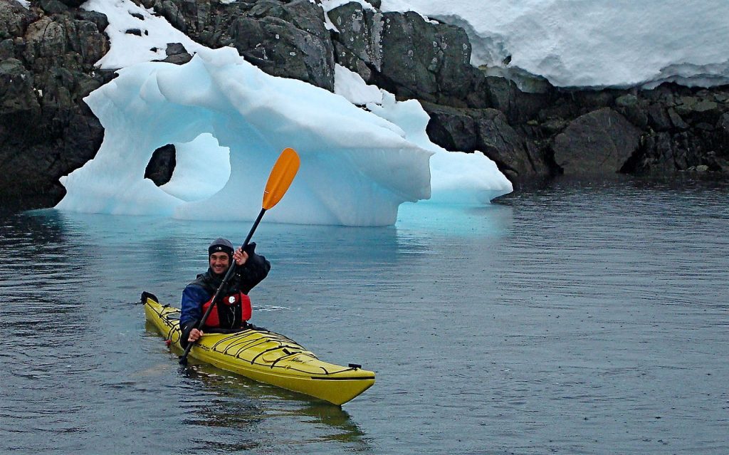 A man with a kayak paddle