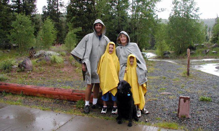 A family wearing best rain poncho