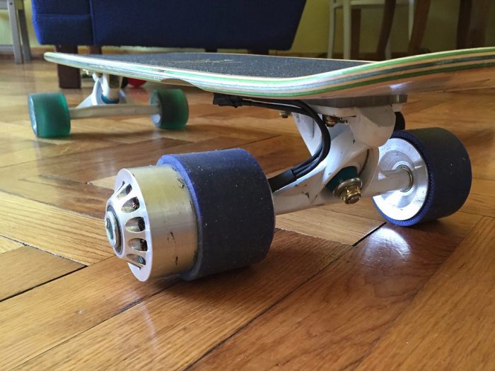 A close up shot of a bright new electric skateboard