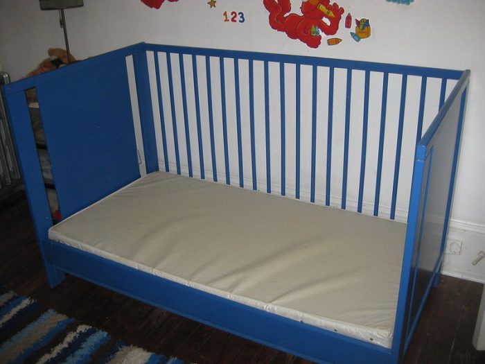 High quality crib mattress in a blue crib.