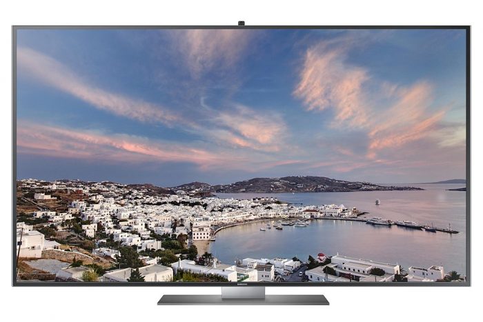 This is a big flat-screen TV. The size can't be determined but it must be around 43 - 50 inches. The wall paper is a beautiful overview of a place and beach.