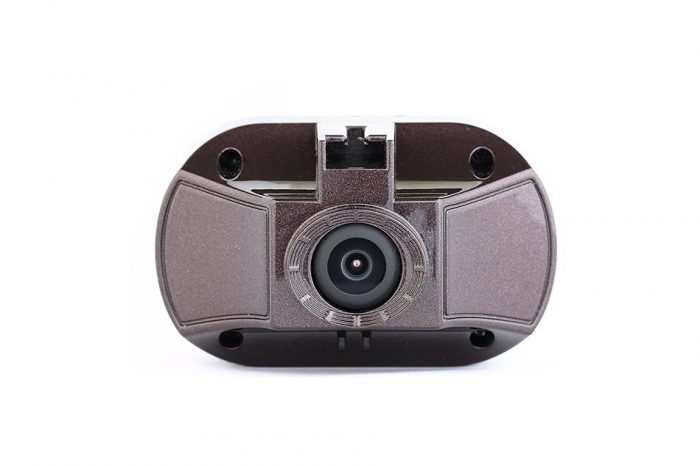 The best dash cam that has the top GPS navigation functionality. A close-up view of a compact dash cam, discreetly installed on the windshield of a vehicle, ready to record every moment of the journey with a dash cam best and advanced features.