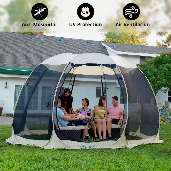 A spacious screen tent set up at a campsite, offering shelter from insects while allowing for outdoor relaxation and dining during camping adventures.