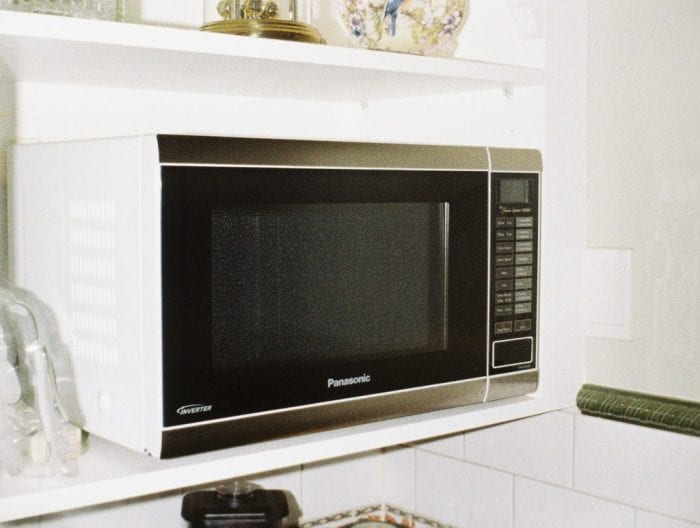 This is a modern and stylish microwave in the kitchen.