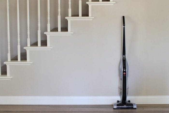 Best cordless stick vacuums laid beside a stairwell wall. The best cordless stick vacs offer excellent cleaning capabilities. Engineered for superior cleaning performance, these stick vacs tools effortlessly tackle dirt and debris, ensuring pristine floors throughout your home. Equipped with powerful suction and advanced cleaning technologies, stick vacs efficiently remove dust, pet hair, and allergens from carpets, hardwood floors, and more.